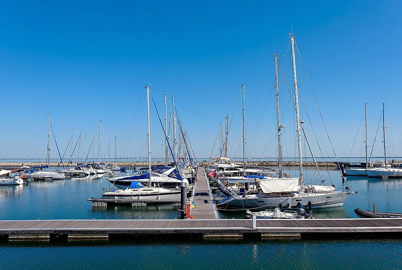 Sailboats moored in the marina at Parque das Nações under a clear sky